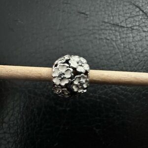 Authentic Pandora “Primrose Meadow” white enamel with clear CZ stones.